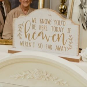 “We know you’d be here today if heaven weren’t so far away” memorial sign